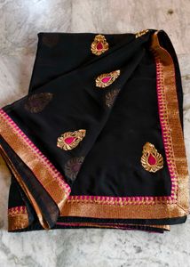 Elegant Black Saree with Gold Embellishments