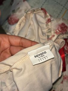 floral top with ribbon design- NOT WORN EVEN ONCE
