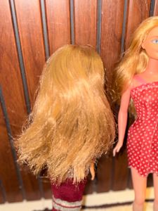 Two barbie dolls