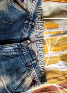 Distressed Blue Denim Jeans
