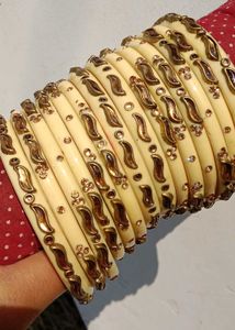 Elegant Cream Bangles with Gold Embellishments