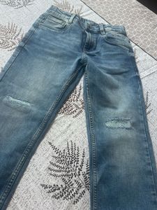 Distressed Blue Denim Jeans