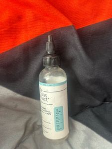 Empty hair oil bottle