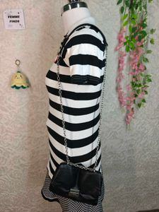 Women's black and white striped polo tee