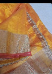 Elegant Yellow &amp; Gold Saree With Red Tint