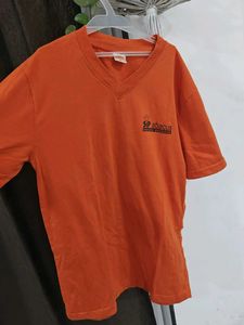 Orange SIP Abacus T-Shirt nd black leggings