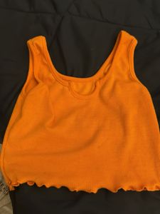 Orange Ribbed Lettuce Hem Crop Top