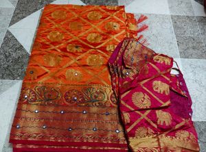 Vibrant Orange Silk Saree with Elephant Motifs
