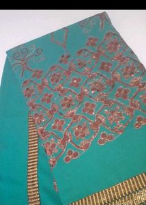 Elegant Teal Saree with Intricate Print