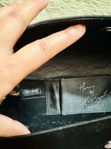 Elegant Black Clutch with Gold Embellishments