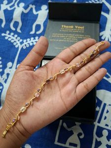 Elegant Gold-Tone Bracelet with Gems