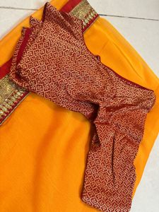 Vibrant Orange Saree with Brocade Blouse