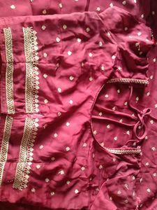 Maroon Georgette Saree with Golden Motifs