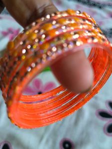 Set of Orange Bangles with Embellishments