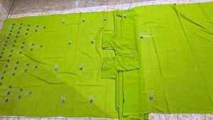 It's a Green coloured saree with blouse