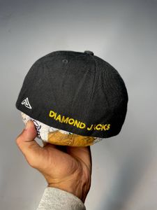 Black baseball cap with yellow 'D' logo