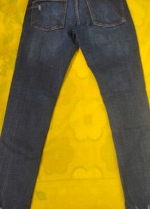 Distressed Blue Denim Jeans