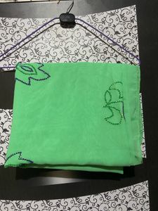 A Light Green Saree With Hand Work