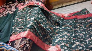 Elegant Dark Green Saree with Red Border