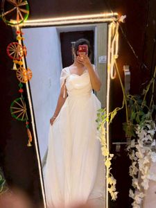 white full length gown with too much detailing