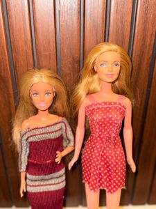 Two barbie dolls