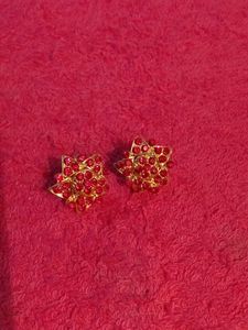 Gold Coloured Studs With Red Stones