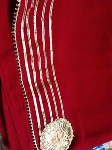 Elegant Red Saree with Gold Embellishments