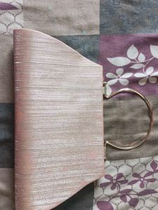Elegant Pink Clutch with Heart Embellishment