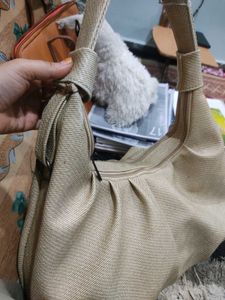 Beige hand beg