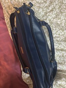 Yelloe V Shaped Zip Blue Hand Held Bag