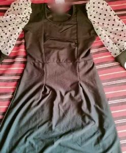 Chic Black Dress with Polka Dot Sleeves