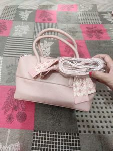 Chic Pink Handbag with Scarf Accent