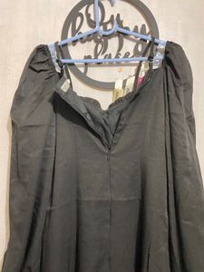 Elegant Black Dress with Embellished Neckline