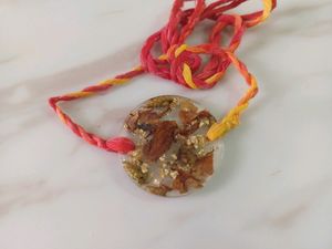 round floral resin rakhi