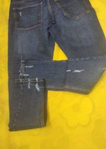 Distressed Blue Denim Jeans