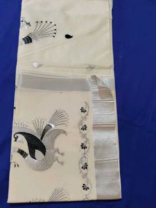 Elegant Cream Saree with Peacock Design