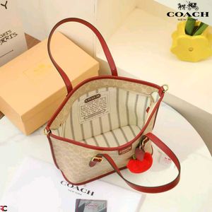 COACH* *TAXI TOTE BAG 21 IN SIGNATURE CANVAS*
