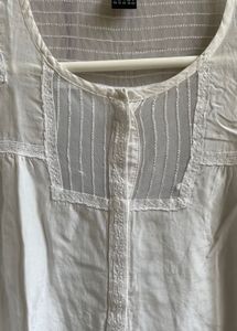 Elegant White Cotton Kurta with Intricate Detailin