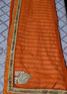 Elegant Orange Saree with Embellished Border