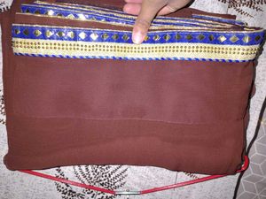 Elegant Brown Saree with Intricate Border