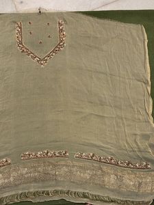 designer blouse piece in soft gold with hand work