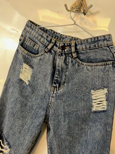 Distressed Blue Denim Jeans