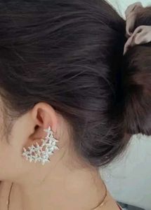 A D silver tone earrings.
