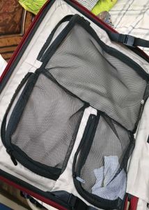 Maroon Hard Shell Luggage Handel grip is broken