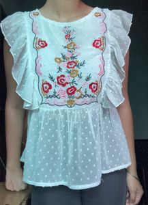 Embroidered White Peplum Top
