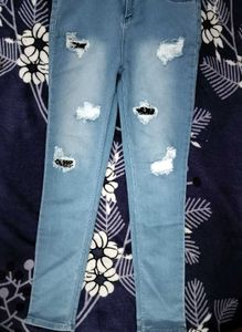 Ripped Light Wash Denim Jeans