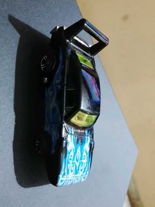 Black hotwheels Car with blue Flames