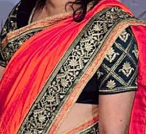 Elegant Orange Saree with Embellished Blouse