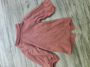 Bundle of baby clothes, beanie, shoes.