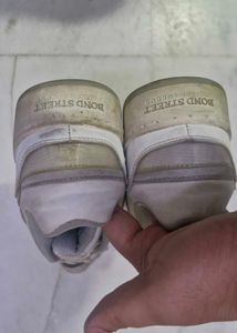 Worn White Sneakers
